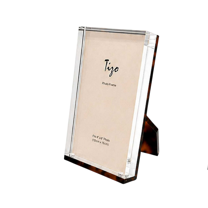 Acrylic Photo Frame in tortoiseshell-patterned Lucite with clear beveled edges, displayed vertically to hold a standard 4 x 6 photo.